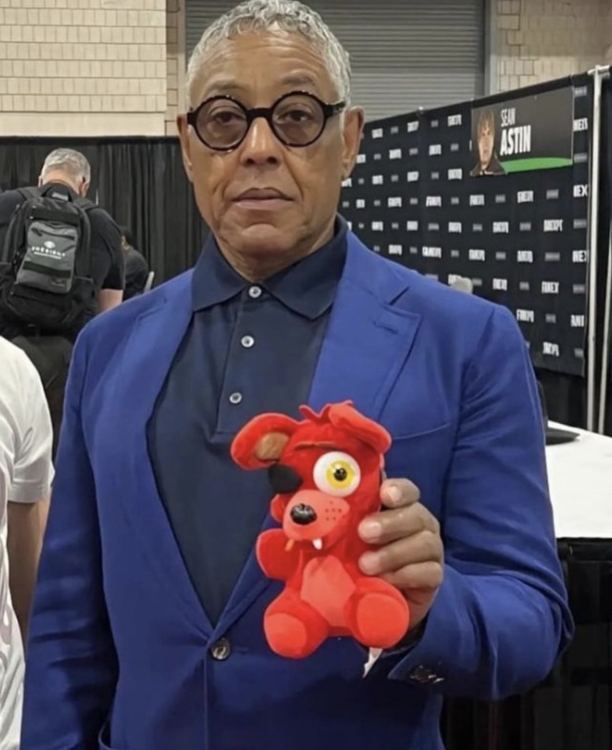 giancarlo esposito holding plush - Sean Astin